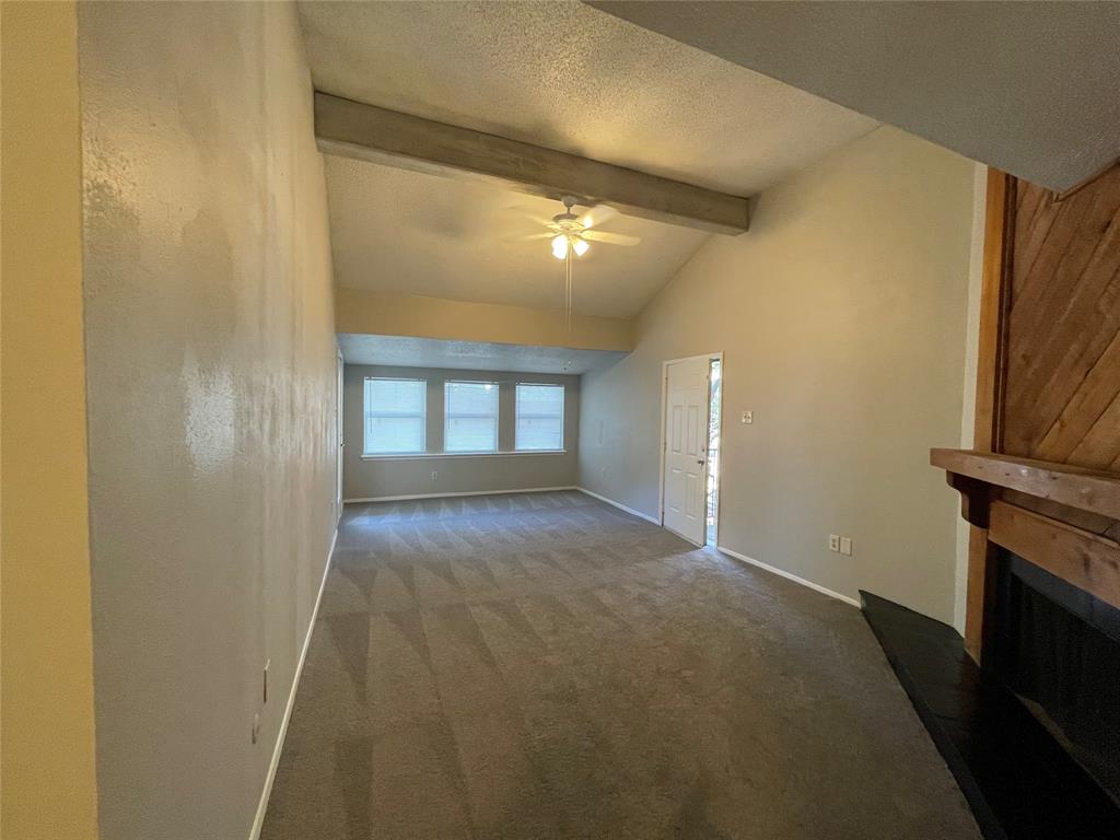 9696 Walnut Street, Unit 1413 Dallas, TX 75243 - Photo 6 of 17 a view of an empty room with a fireplace