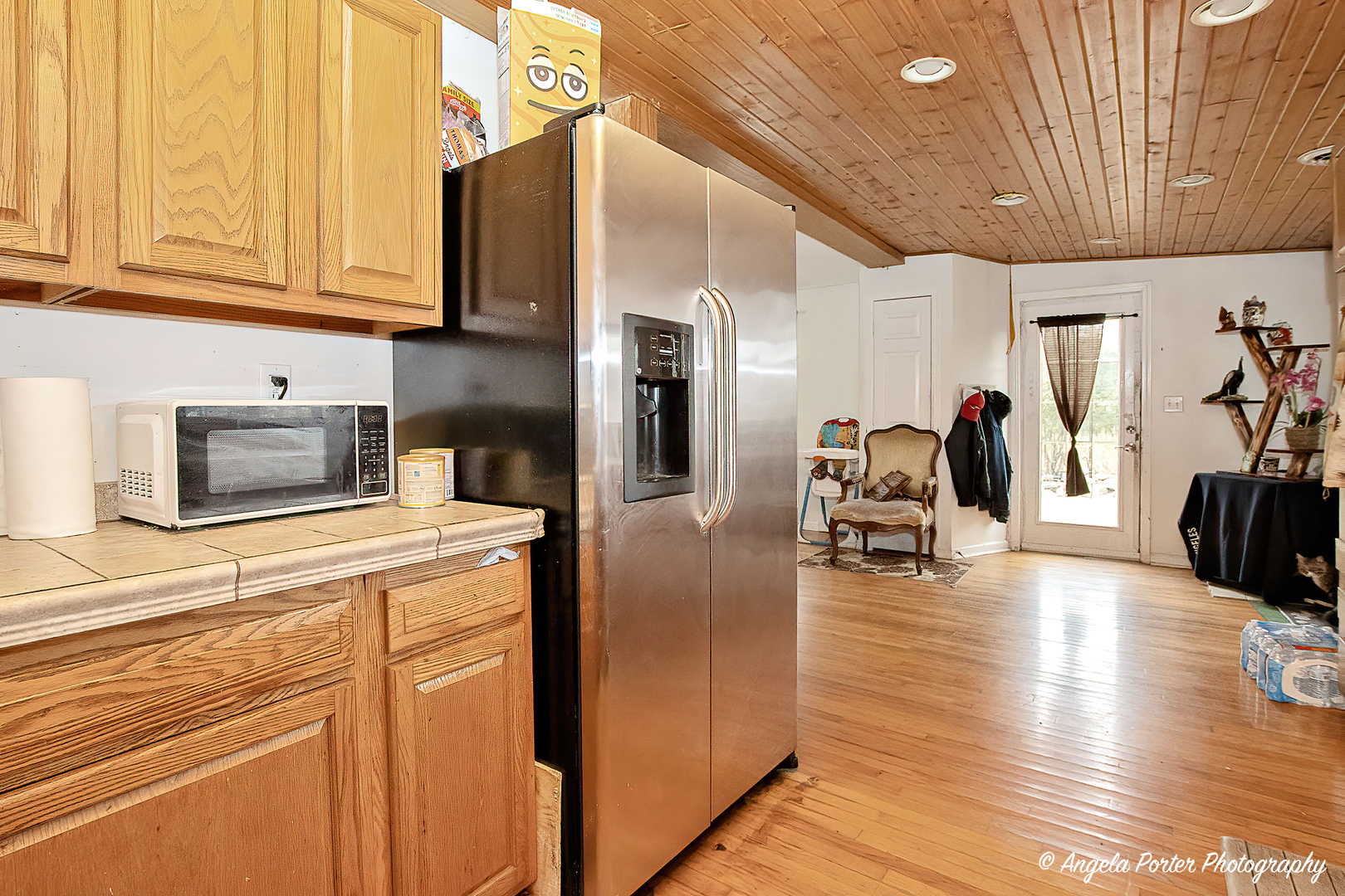 19212 Crowley Road Harvard, IL 60033 - Photo 11 of 38 a kitchen with stainless steel appliances kitchen island granite countertop a refrigerator and cabinets