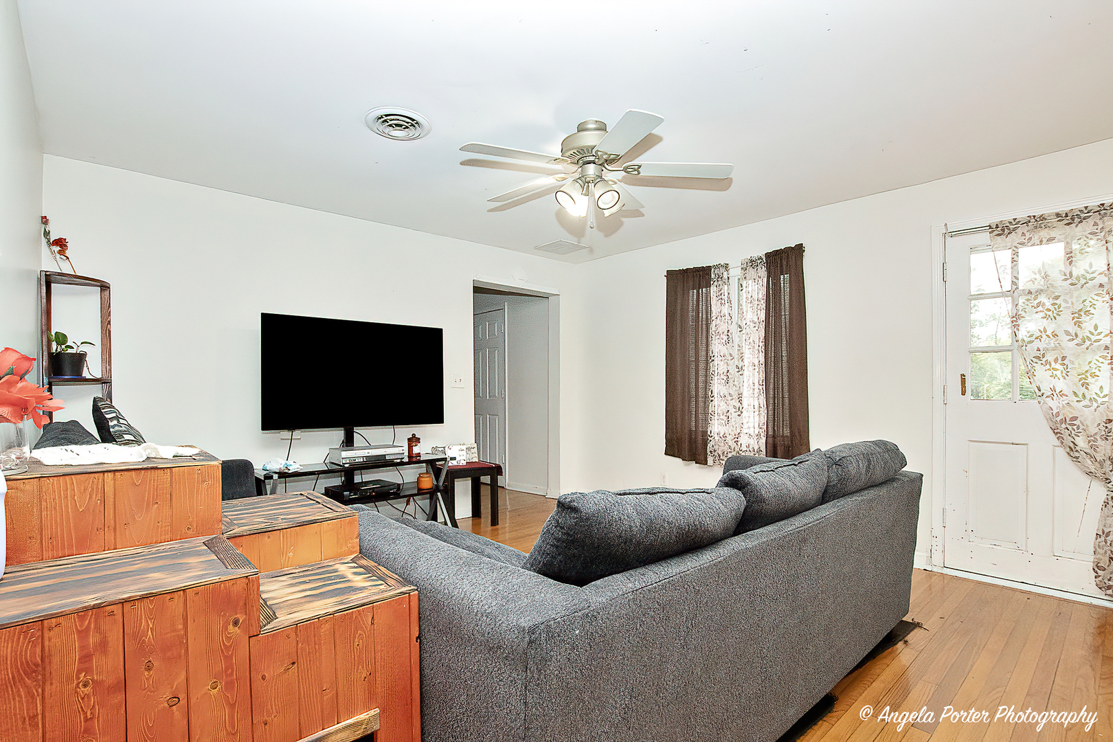 19212 Crowley Road Harvard, IL 60033 - Photo 13 of 38 a living room with furniture and a flat screen tv