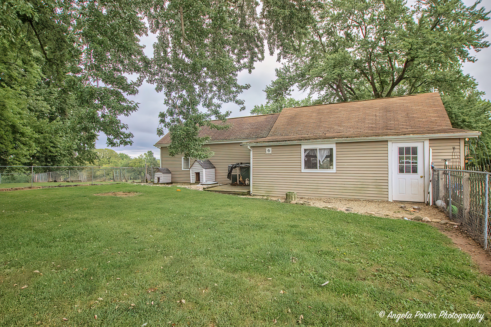 19212 Crowley Road Harvard, IL 60033 - Photo 25 of 38 a view of a yard in front of a house with large trees