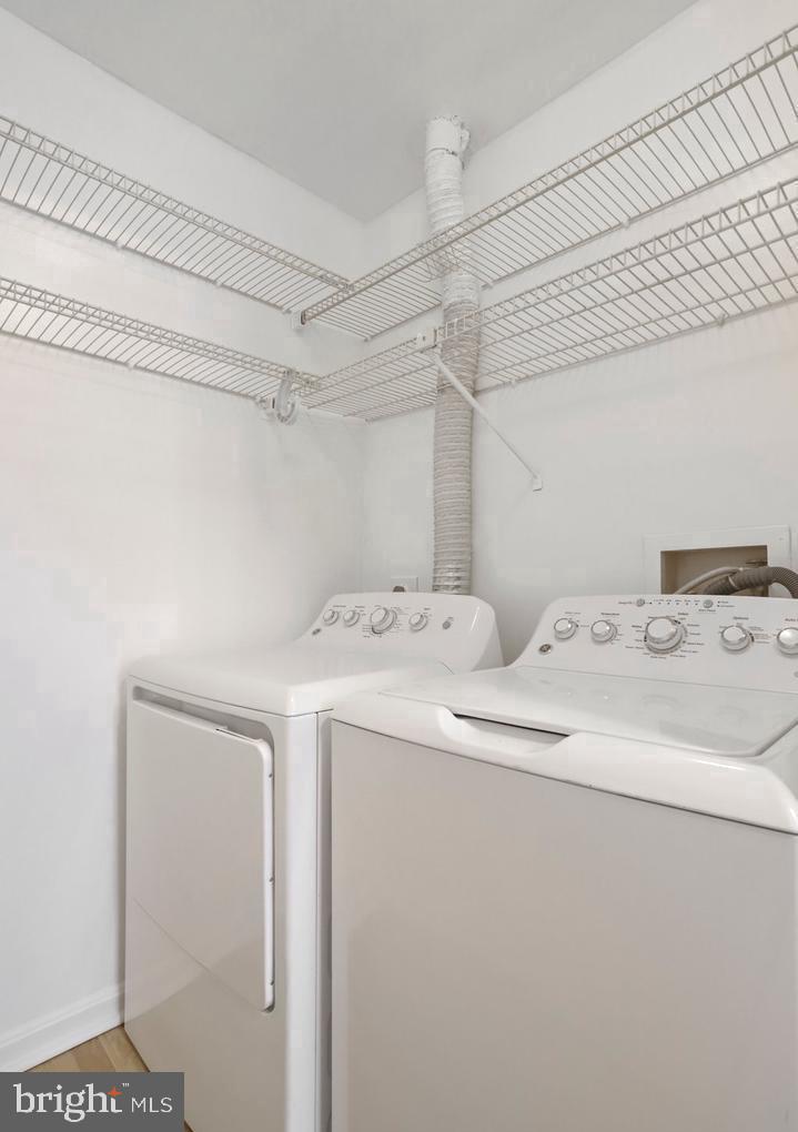 18324 Streamside Drive, Unit 301 Gaithersburg, MD 20879 - Photo 17 of 19 a utility room with dryer and washer
