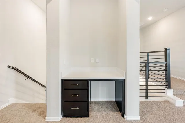 a room with windows and a cabinet