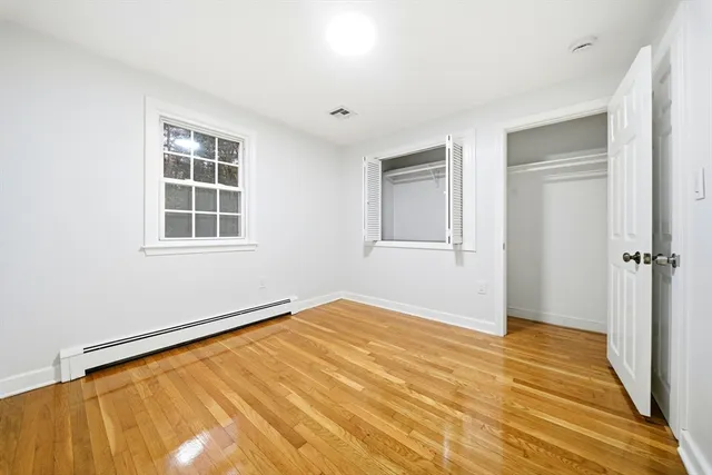 a view of balcony with wooden floor and fence