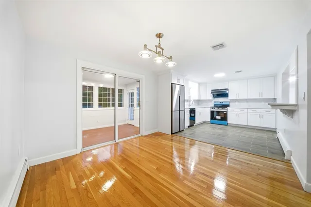 a kitchen with a refrigerator stove and microwave