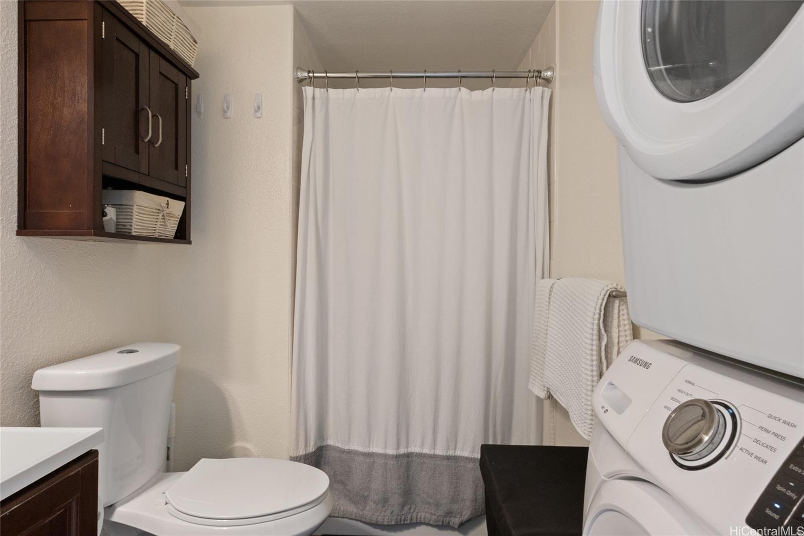 92-1232 Palahia Street, Unit AA102 Kapolei, HI 96707 - Photo 14 of 25 a bathroom with a sink a toilet and a mirror