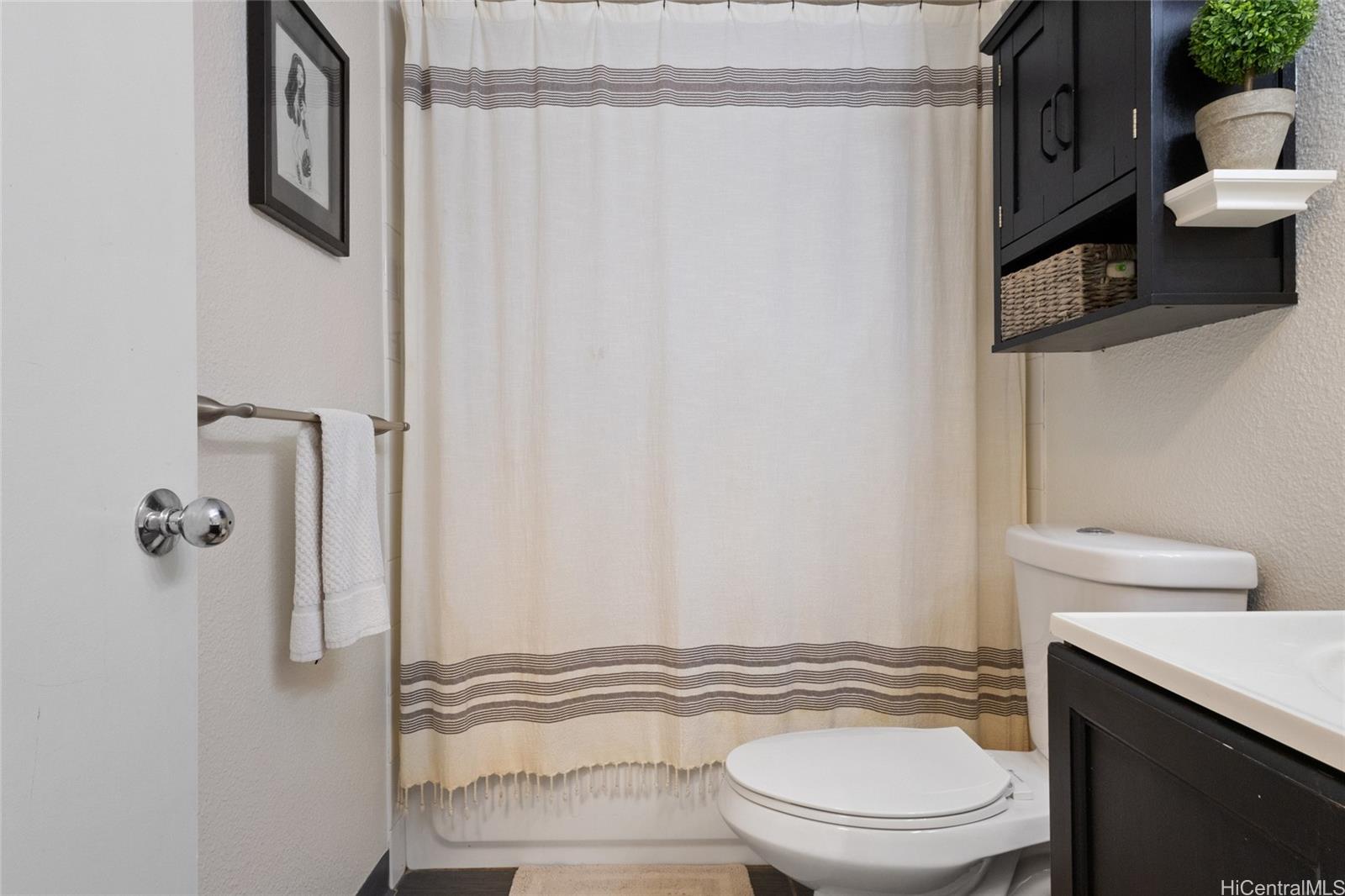 92-1232 Palahia Street, Unit AA102 Kapolei, HI 96707 - Photo 15 of 25 a bathroom with a sink toilet and shower