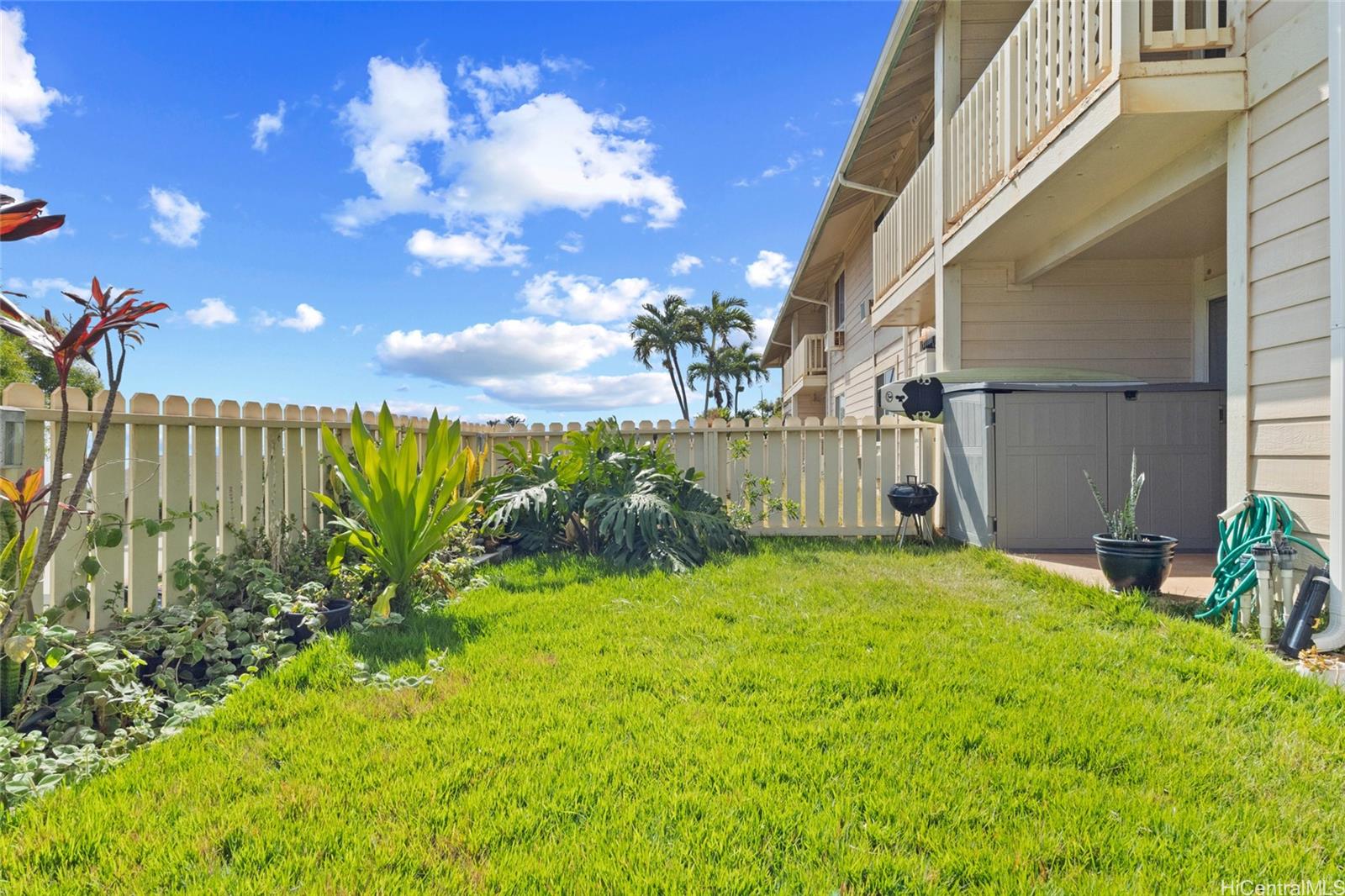 92-1232 Palahia Street, Unit AA102 Kapolei, HI 96707 - Photo 17 of 25 a view of backyard with patio