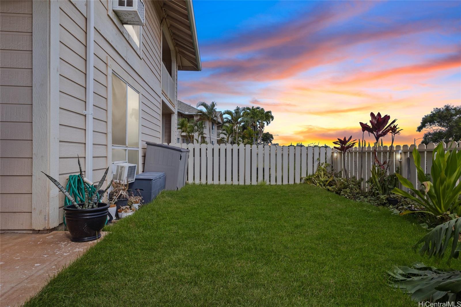 92-1232 Palahia Street, Unit AA102 Kapolei, HI 96707 - Photo 18 of 25 a view of a backyard with a garden