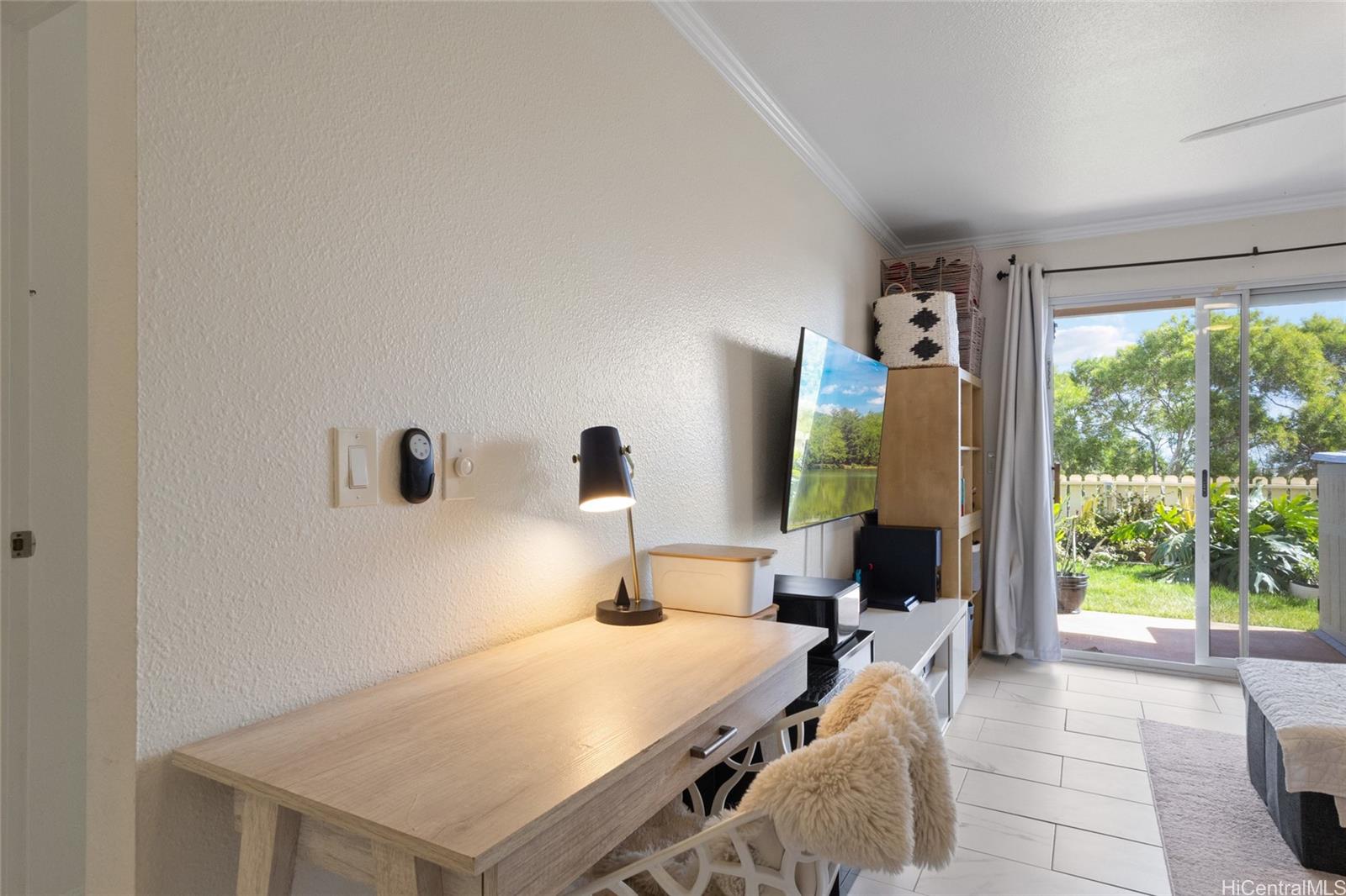 92-1232 Palahia Street, Unit AA102 Kapolei, HI 96707 - Photo 2 of 25 a bedroom with a bed and a large window