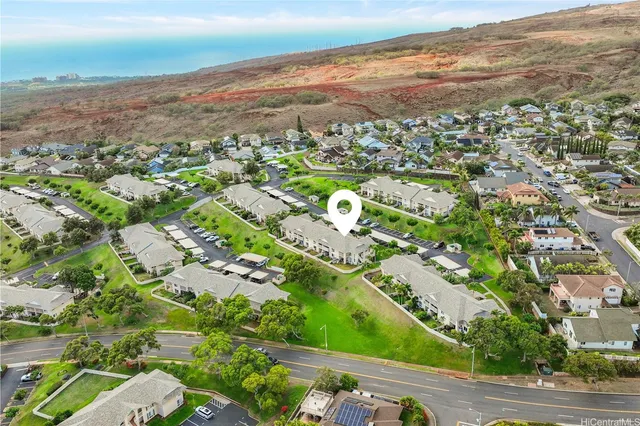 an aerial view of residential houses with outdoor space
