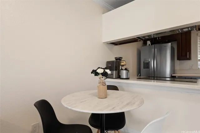 a kitchen with a table and chairs