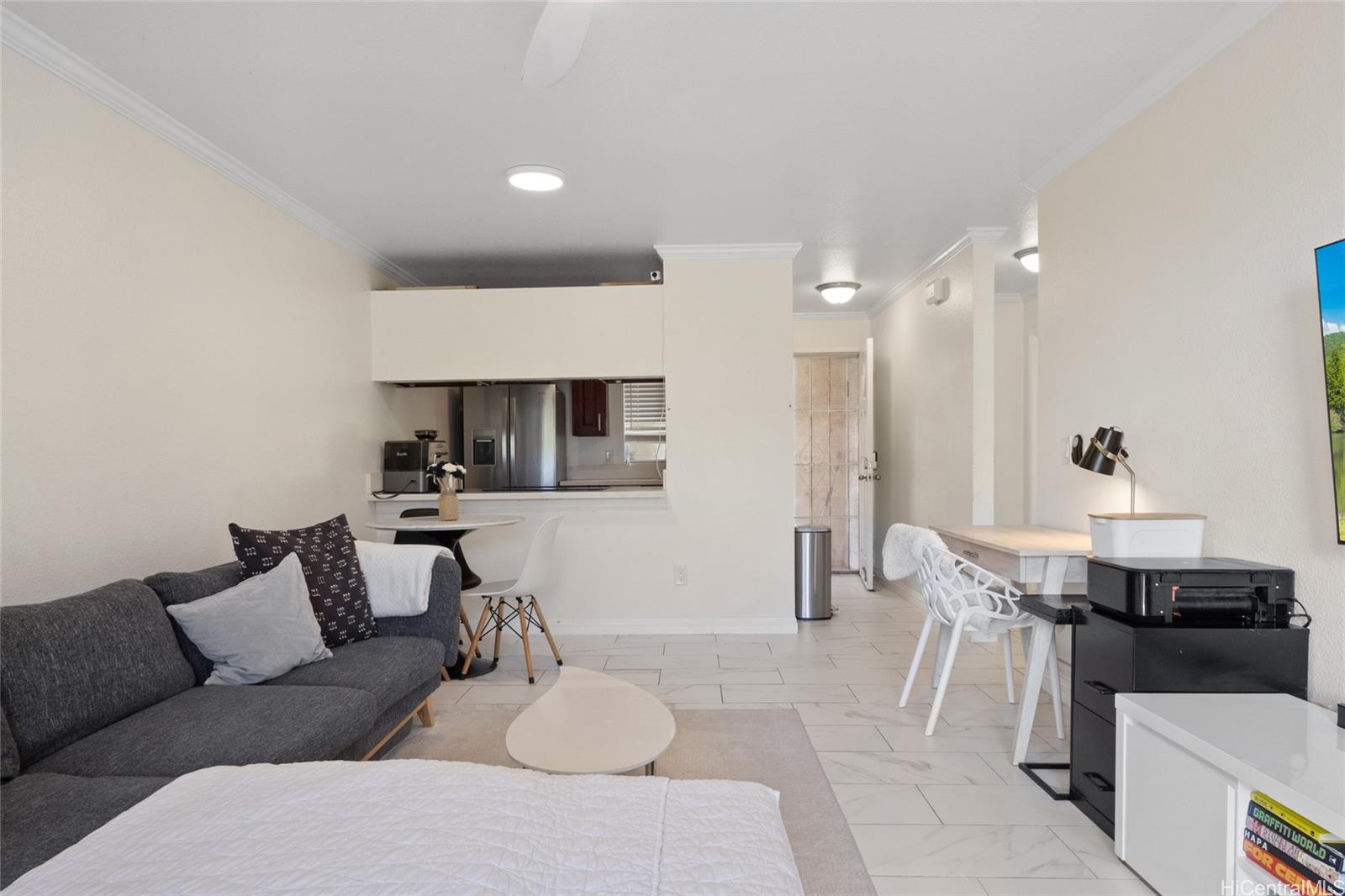 92-1232 Palahia Street, Unit AA102 Kapolei, HI 96707 - Photo 6 of 25 a living room with furniture and kitchen view