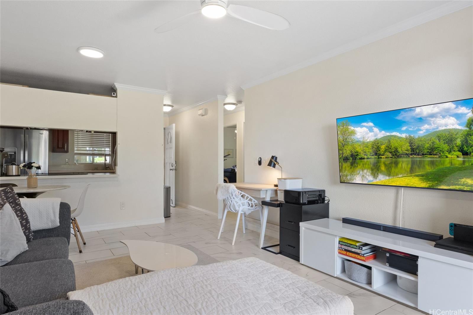 92-1232 Palahia Street, Unit AA102 Kapolei, HI 96707 - Photo 7 of 25 a living room with furniture and a flat screen tv
