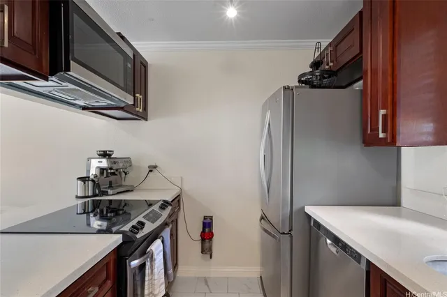 a kitchen with stainless steel appliances a sink and a refrigerator