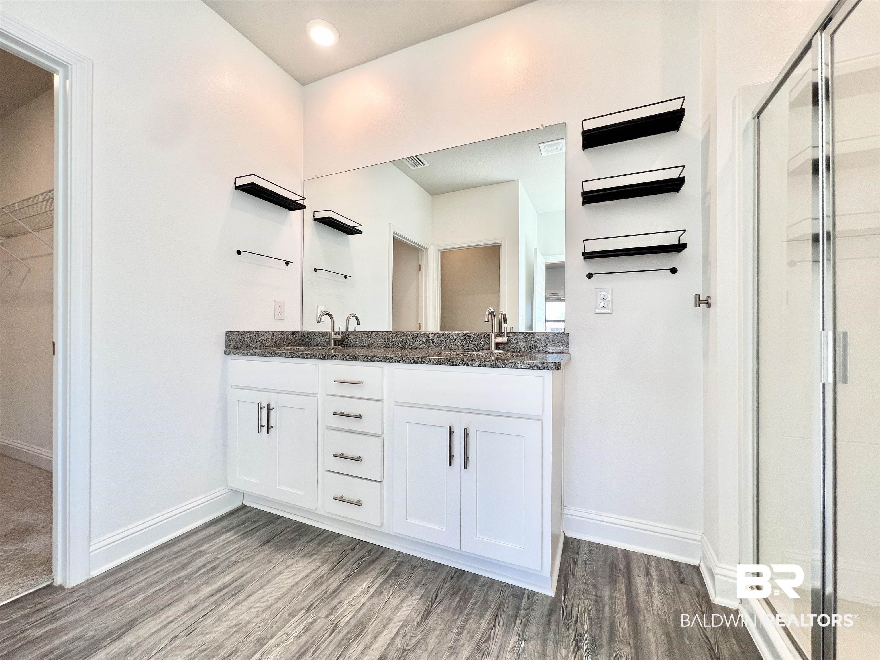 24785 Slater Mill Road Daphne, AL 36526 - Photo 28 of 46 Bathroom with vanity, an enclosed shower, and hardwood / wood-style floors