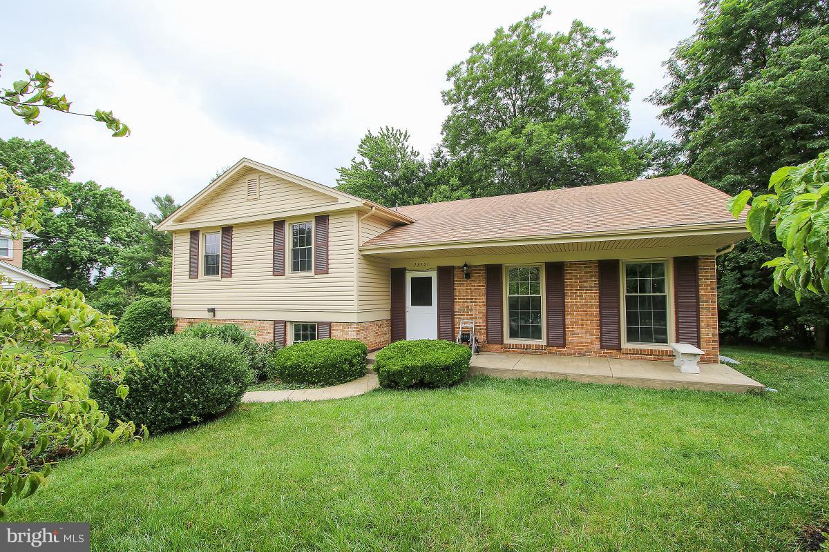 13121 Tamarack Road Silver Spring, MD 20904 - Photo 2 of 30 a view of a house with a yard and plants