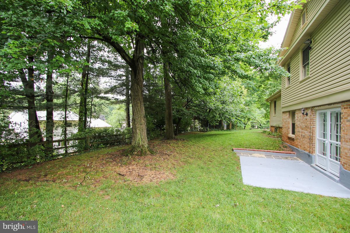 13121 Tamarack Road Silver Spring, MD 20904 - Photo 29 of 30 a view of a house with backyard and a tree