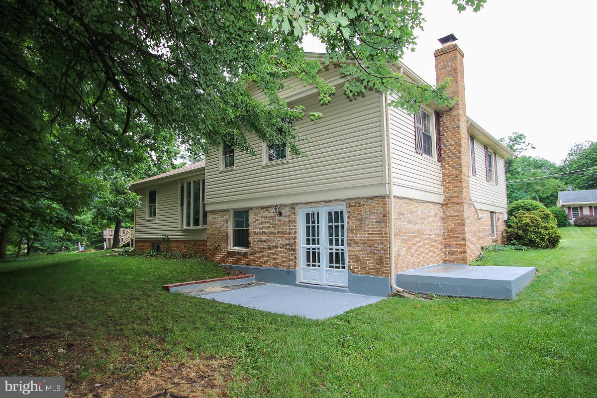 13121 Tamarack Road Silver Spring, MD 20904 - Photo 30 of 30 a front view of a house with a yard and trees