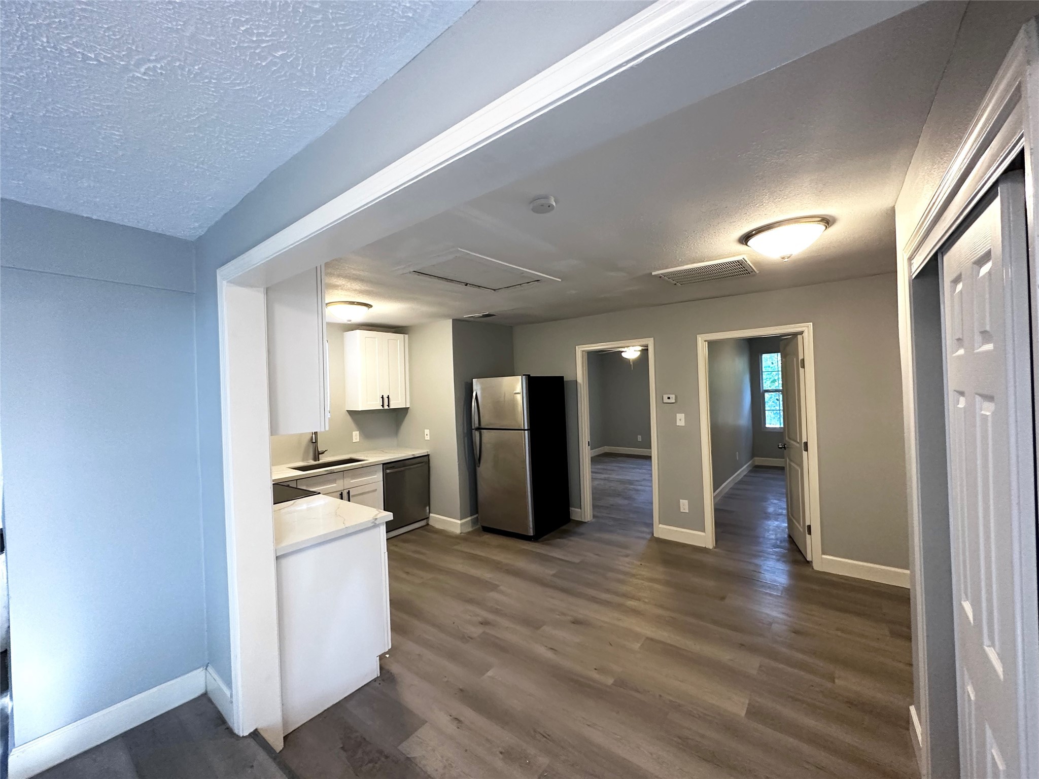 4318 1st Street, Unit B Bacliff, TX 77518 - Photo 7 of 21 a view of a kitchen with wooden floor