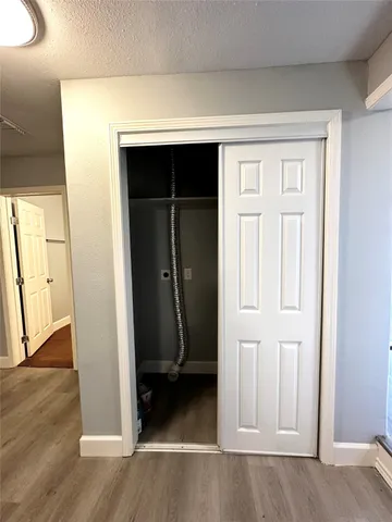 an entryway with wooden floor