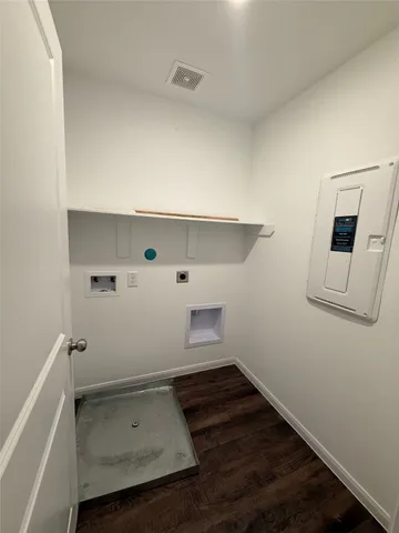 a view of utility room and empty room