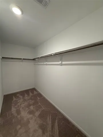 a view of a room with shelf on the wall