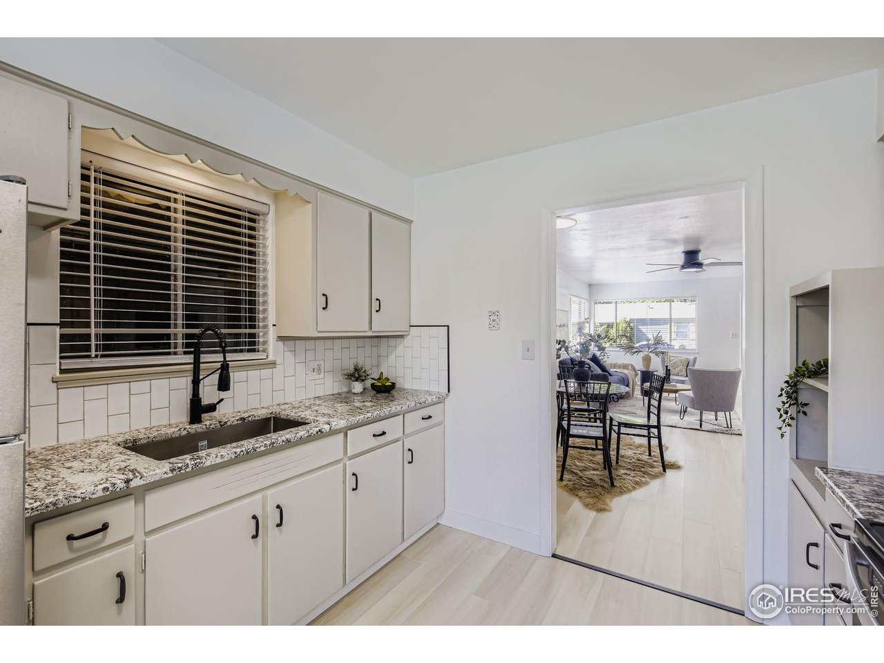 604 Colorado Street Fort Collins, CO 80524 - Photo 12 of 32 a kitchen with granite countertop a sink and cabinets