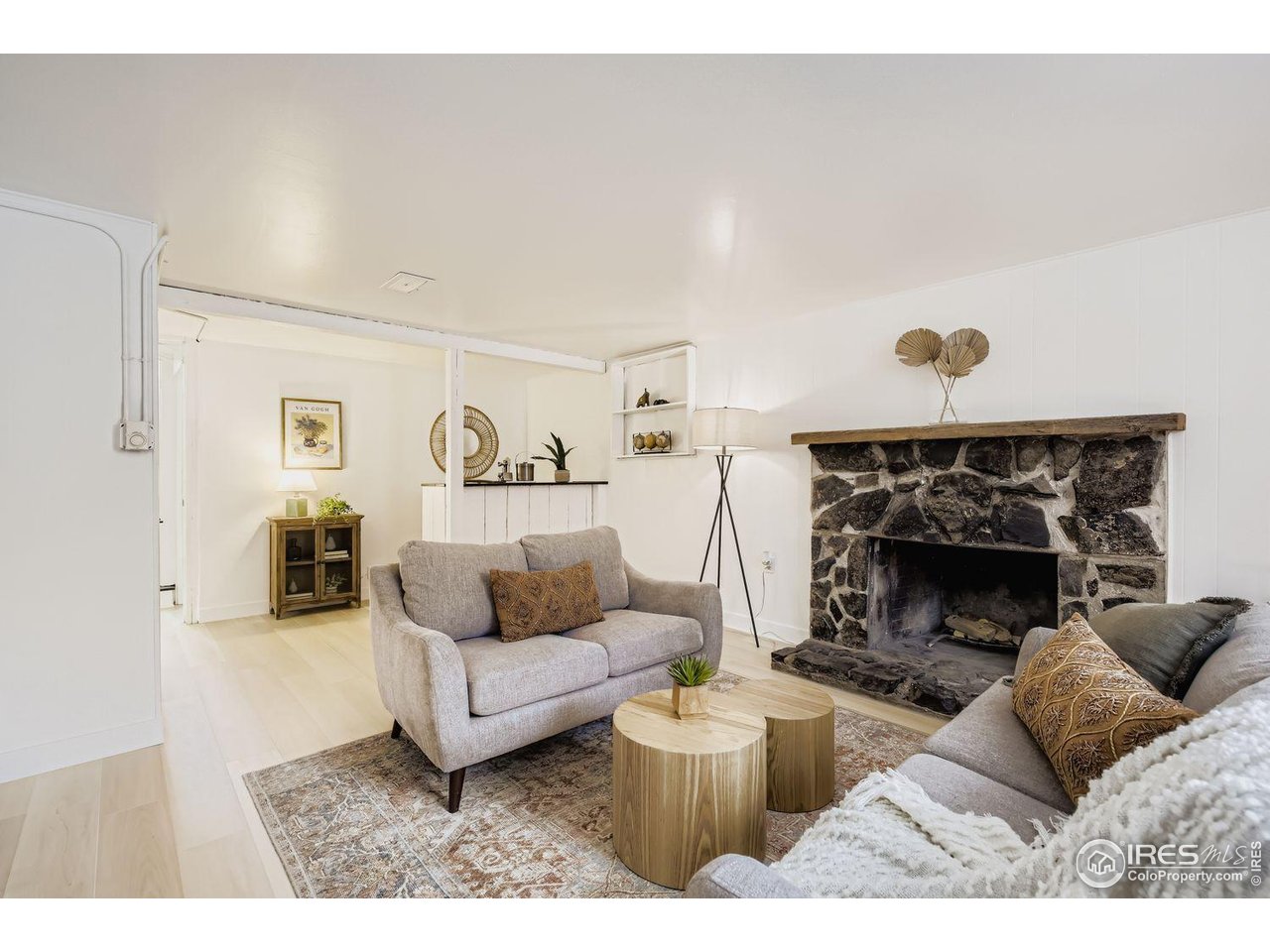 604 Colorado Street Fort Collins, CO 80524 - Photo 19 of 32 a living room with furniture and a fireplace