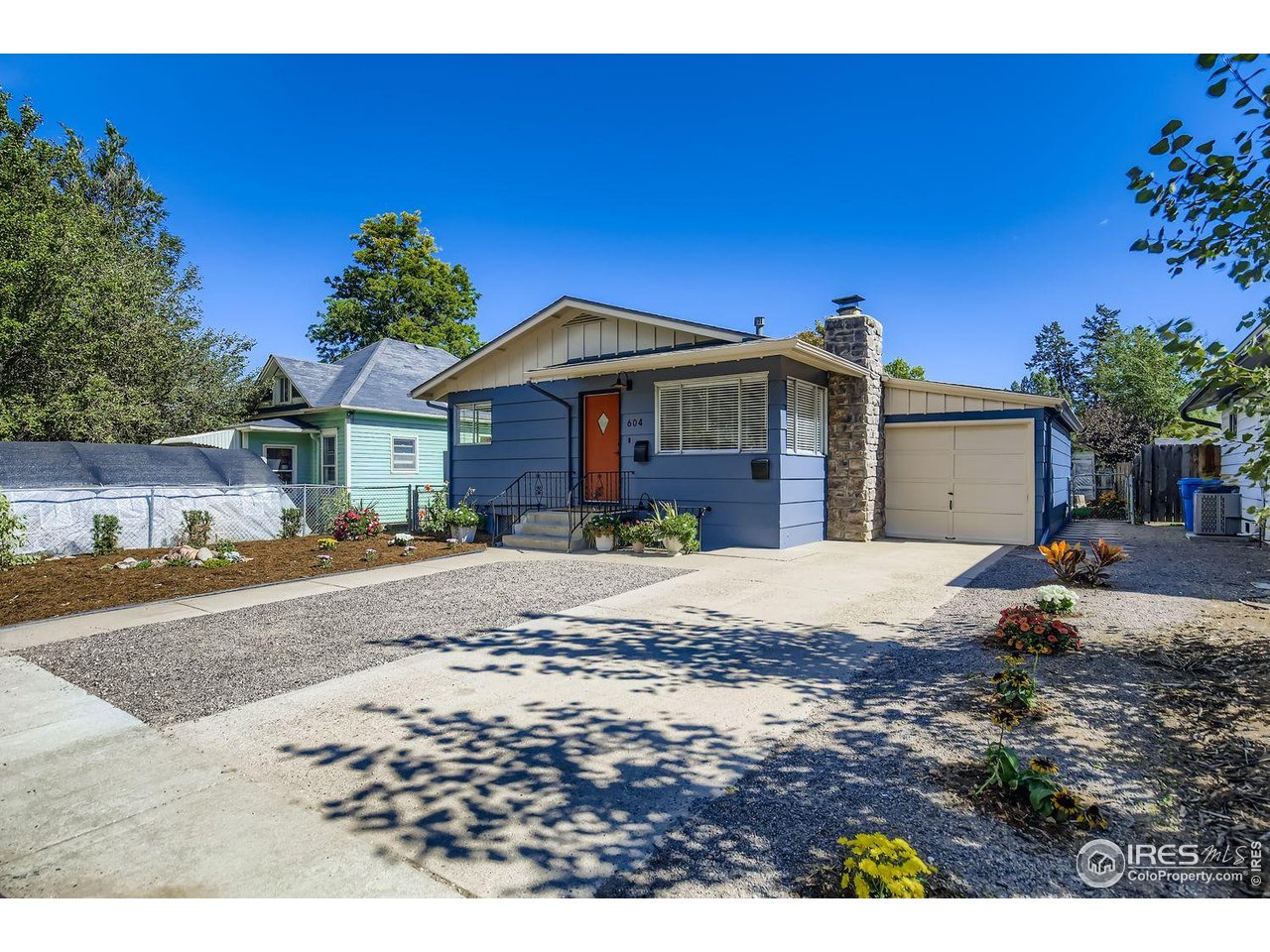 604 Colorado Street Fort Collins, CO 80524 - Photo 2 of 32 a front view of a house with a garden