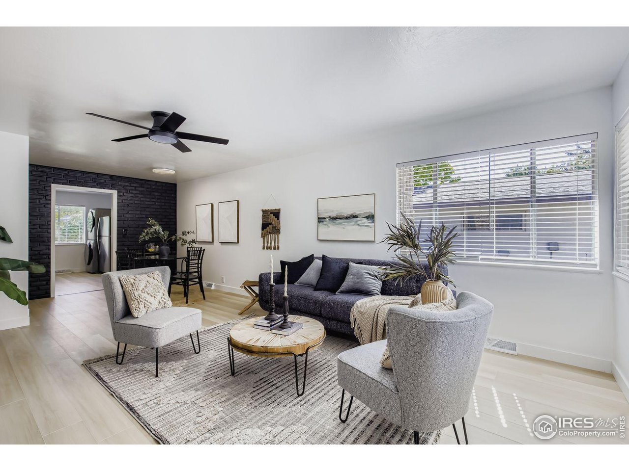 604 Colorado Street Fort Collins, CO 80524 - Photo 6 of 32 a living room with furniture and wooden floor