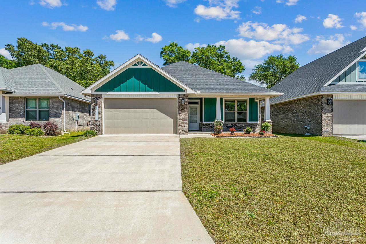 3875 Shady Grove Drive Pace, FL 32571 - Photo 1 of 31 front view of a house with a yard
