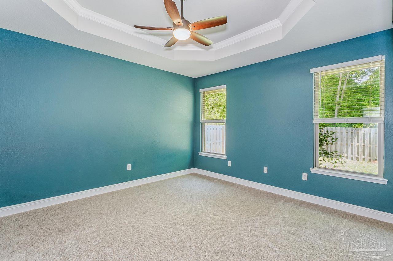 3875 Shady Grove Drive Pace, FL 32571 - Photo 14 of 31 an empty room and window and a fan