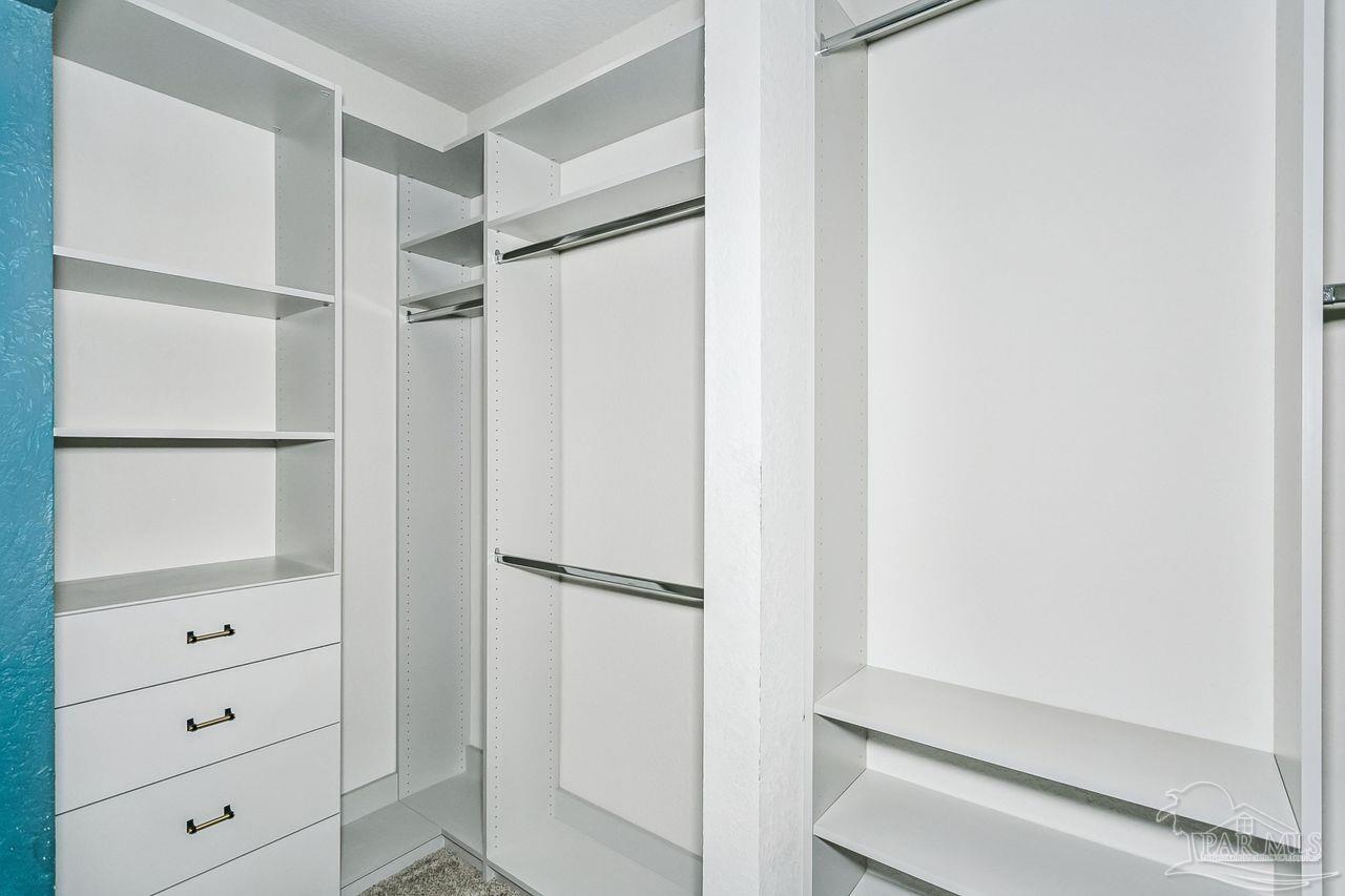 3875 Shady Grove Drive Pace, FL 32571 - Photo 16 of 31 a view of walk in closet with cabinet
