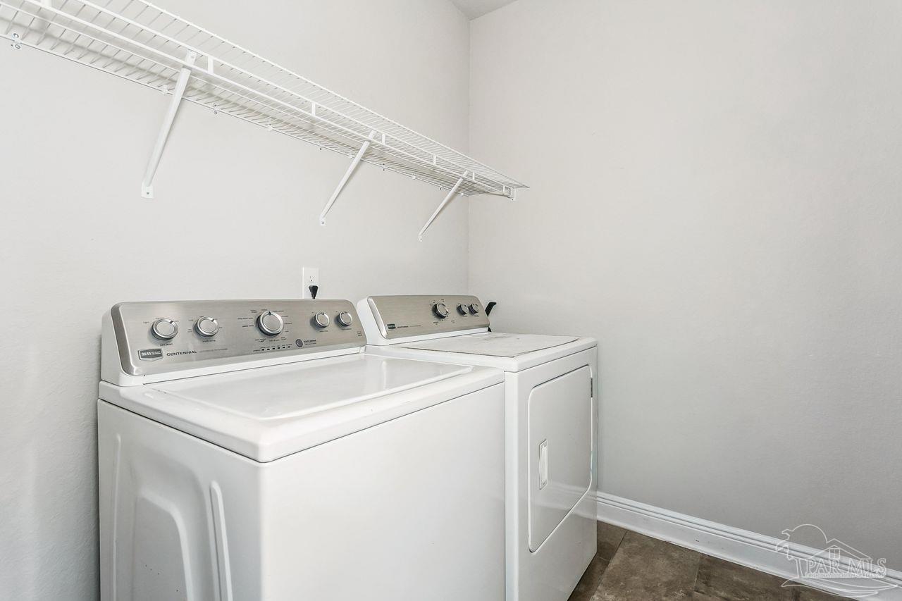 3875 Shady Grove Drive Pace, FL 32571 - Photo 24 of 31 a utility room with dryer and washer