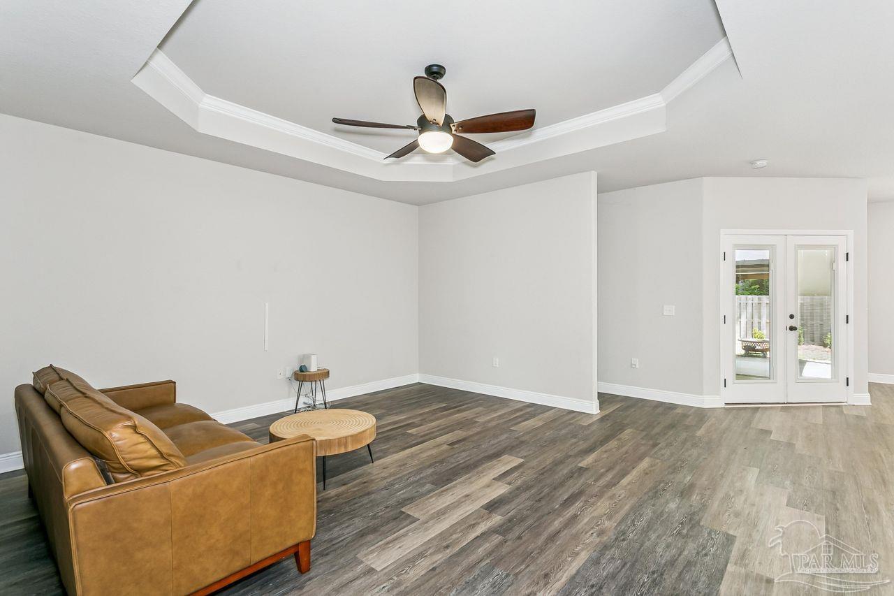 3875 Shady Grove Drive Pace, FL 32571 - Photo 6 of 31 a living room with furniture and a ceiling fan