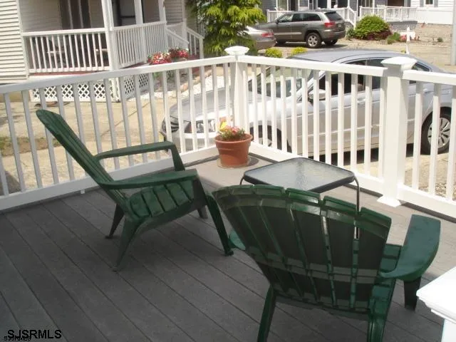 a view of a chairs and table on the deck