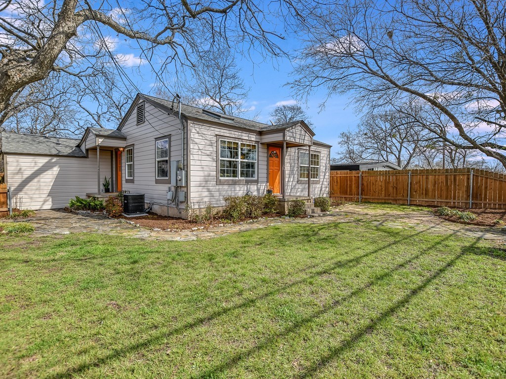 a front view of house with yard and seating area