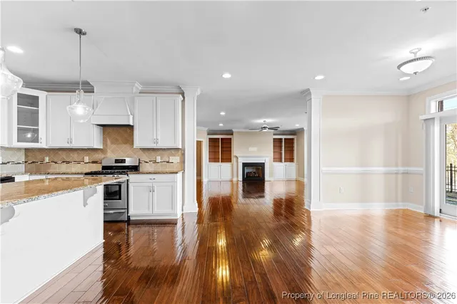 a view of hallway with wooden floor