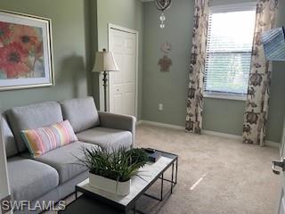 3149 Aviamar Circle, Unit 101 Naples, FL 34114 - Photo 11 of 20 a living room with furniture and a window