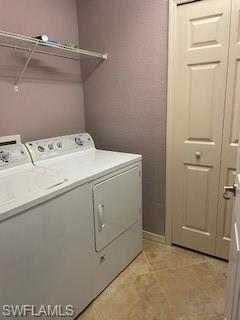 3149 Aviamar Circle, Unit 101 Naples, FL 34114 - Photo 12 of 20 a utility room with dryer and washer