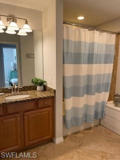 3149 Aviamar Circle, Unit 101 Naples, FL 34114 - Photo 13 of 20 a bathroom with a granite countertop sink a mirror and a shower