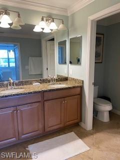 3149 Aviamar Circle, Unit 101 Naples, FL 34114 - Photo 18 of 20 a bathroom with a granite countertop sink a toilet and a mirror