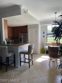 a kitchen with a table chairs and a dining table