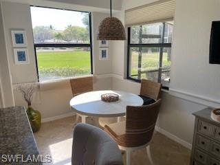 3149 Aviamar Circle, Unit 101 Naples, FL 34114 - Photo 6 of 20 a view of a dining room with furniture window and outside view