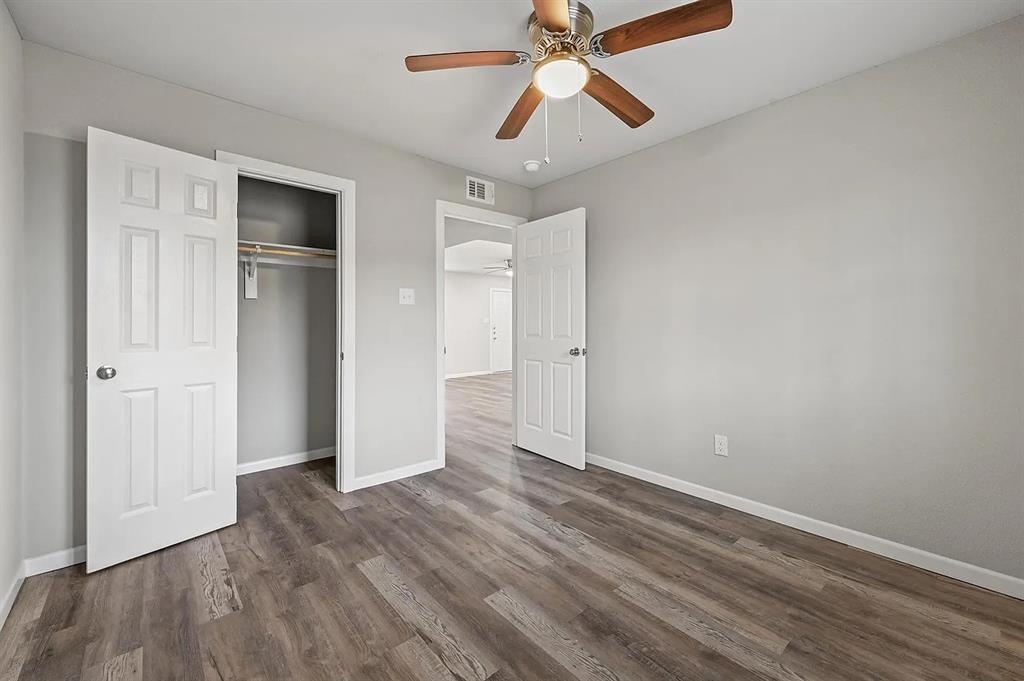 500 Highway 75, Unit 35 Van Alstyne, TX 75495 - Photo 8 of 12 Room featuring wood-finish flooring, light gray wall paint, and white baseboards