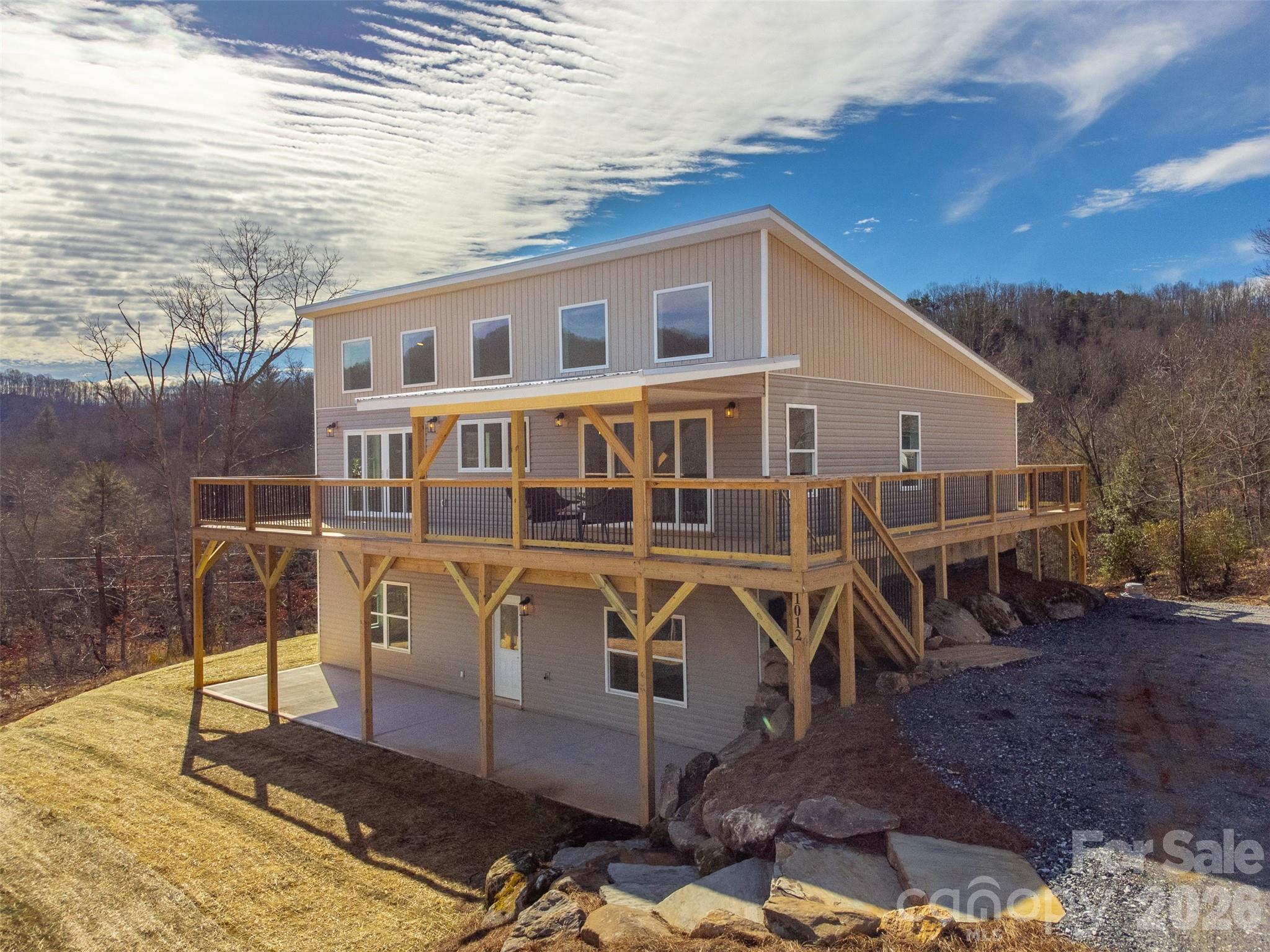 1012 Sols Creek Church Road Tuckasegee, NC 28783 - Photo 1 of 25 a view of a house with backyard