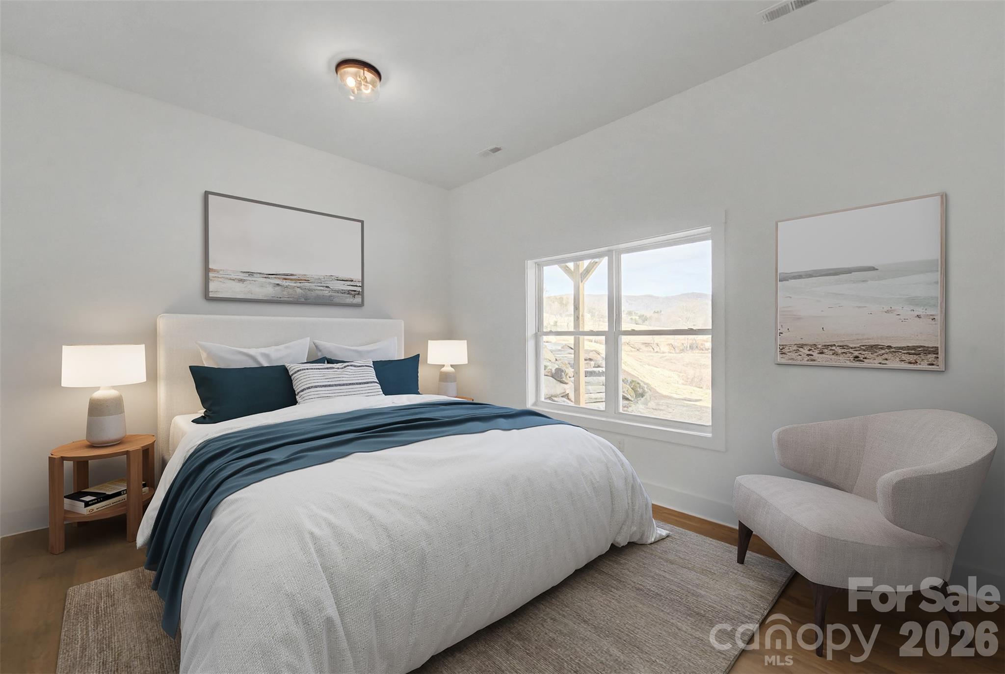 1012 Sols Creek Church Road Tuckasegee, NC 28783 - Photo 17 of 25 a bedroom with a bed and a couch