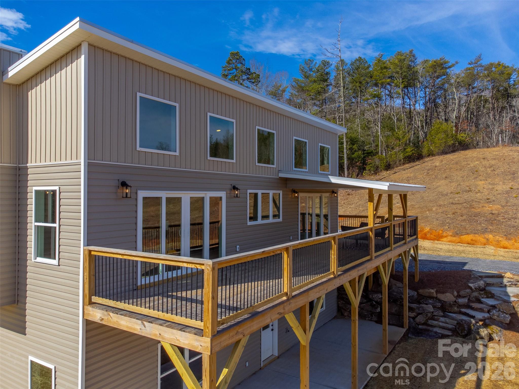 1012 Sols Creek Church Road Tuckasegee, NC 28783 - Photo 19 of 25 a balcony with table and chairs