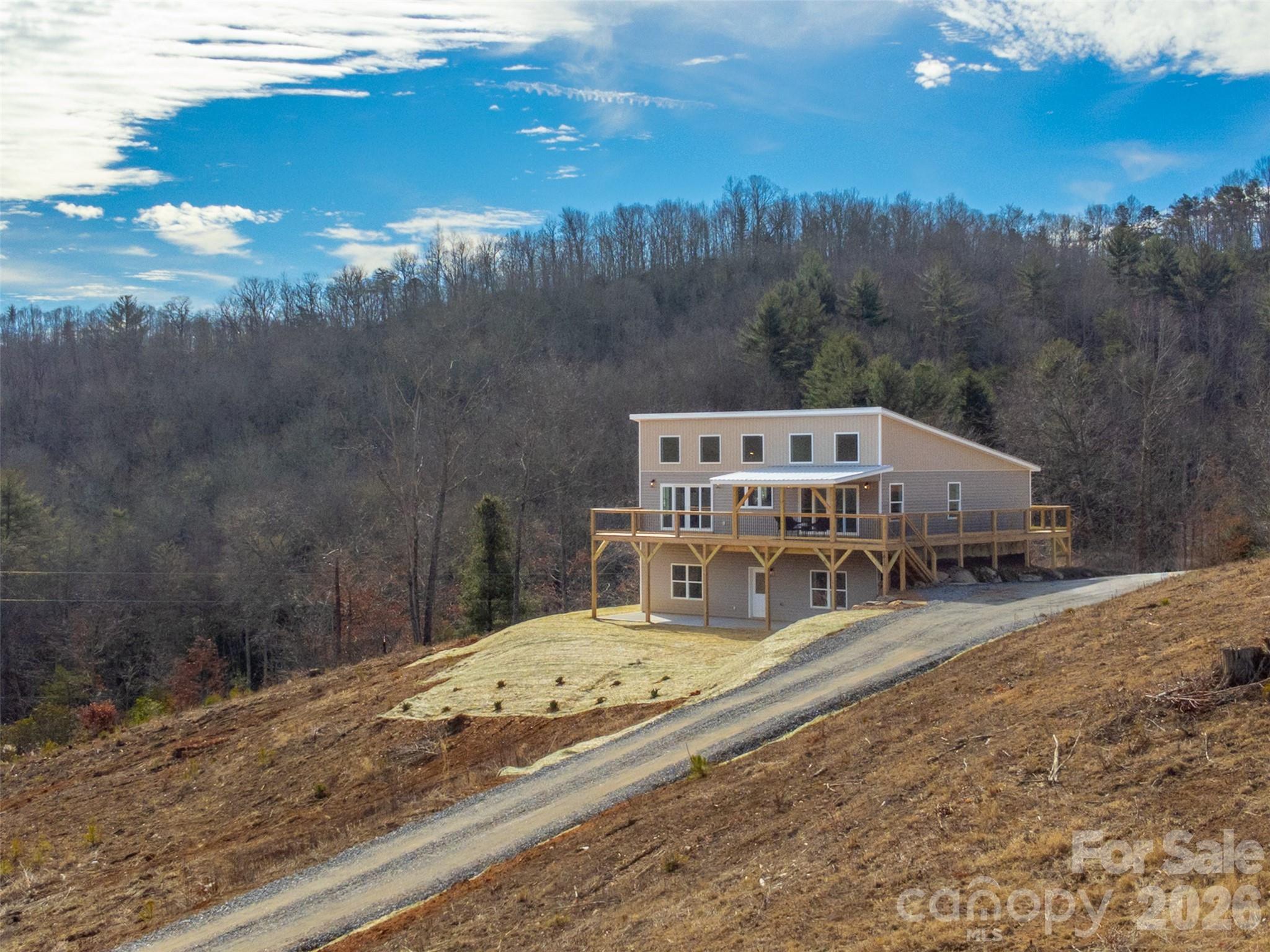 1012 Sols Creek Church Road Tuckasegee, NC 28783 - Photo 20 of 25 a view of a house with a yard