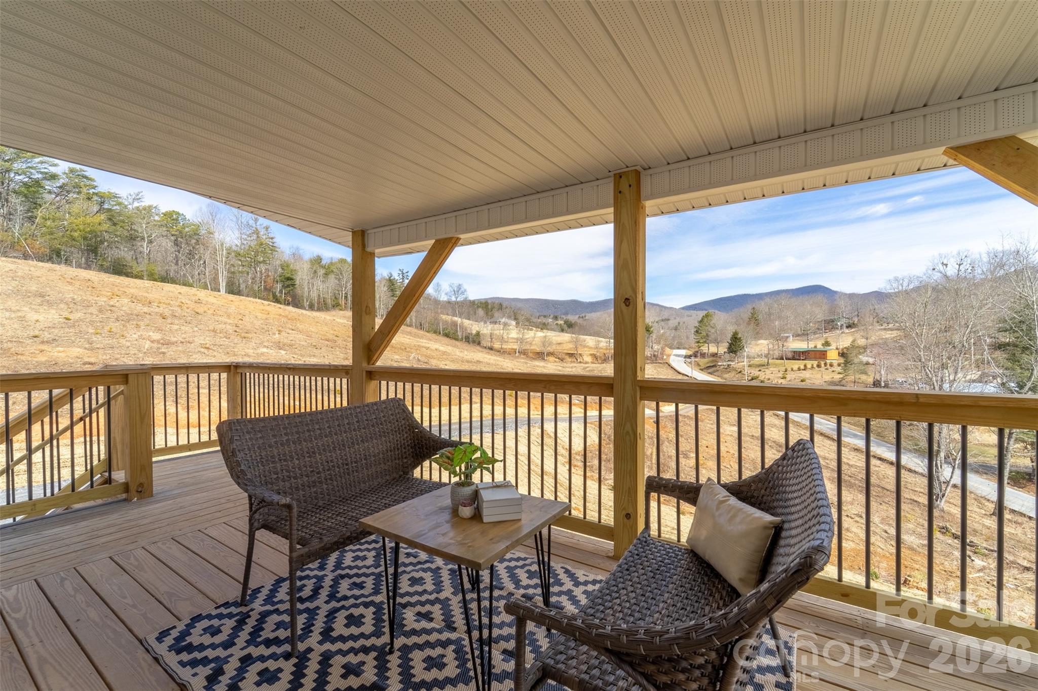 1012 Sols Creek Church Road Tuckasegee, NC 28783 - Photo 2 of 25 a balcony view with a seating space